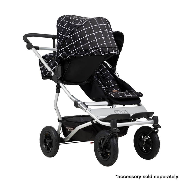 Mountain Buggy duet double buggy fitted with one carrycot plus in parent facing seat position in colour grid_grid