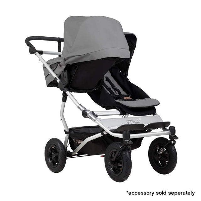 Mountain Buggy duet double buggy fitted with one carrycot plus in parent facing seat position in colour silver_silver