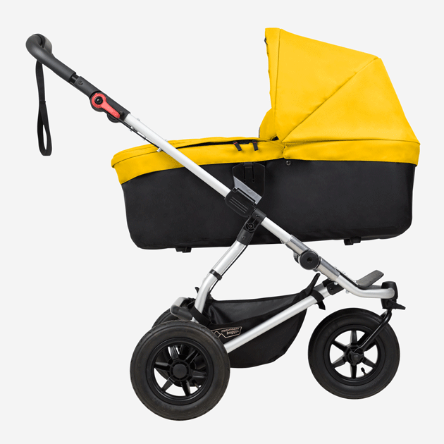 mountain buggy swift compact buggy with carrycot plus showing riding modes side view in color gold_gold