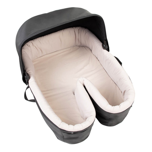 elevated view of the carrycot plus for twins with the cover removed to highlight the large internal space for babies_black