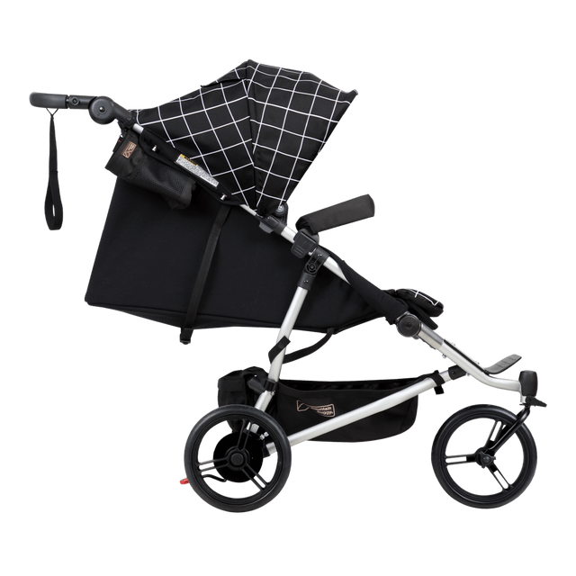Mountain Buggy duet double buggy side view with main seat in lie flat position in colour grid_grid