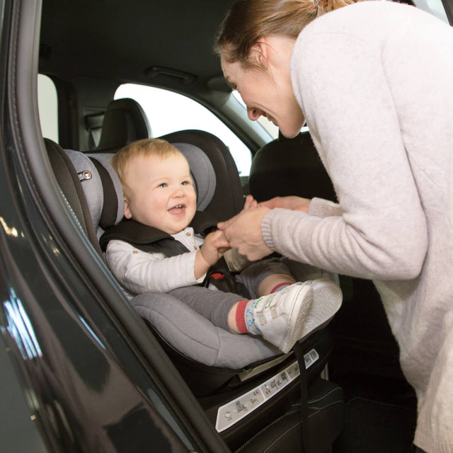 toddler sitting in Mountain Buggy safe rotate car seat facing mum in parent position_default